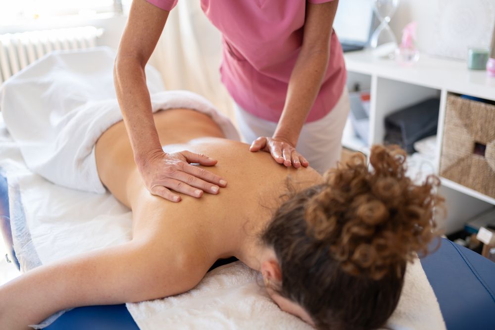 Female client receiving massage