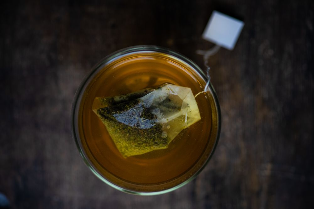 Top view of glass of green tea in cup