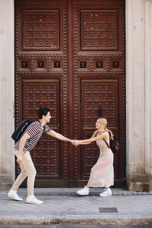 Happy couple having fun while walking in town