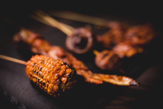 Tasty grilled skewers on table in cafe