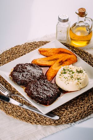 Traditional Venezuelan dish, Beef, Mashed potatoes and Fried plantains