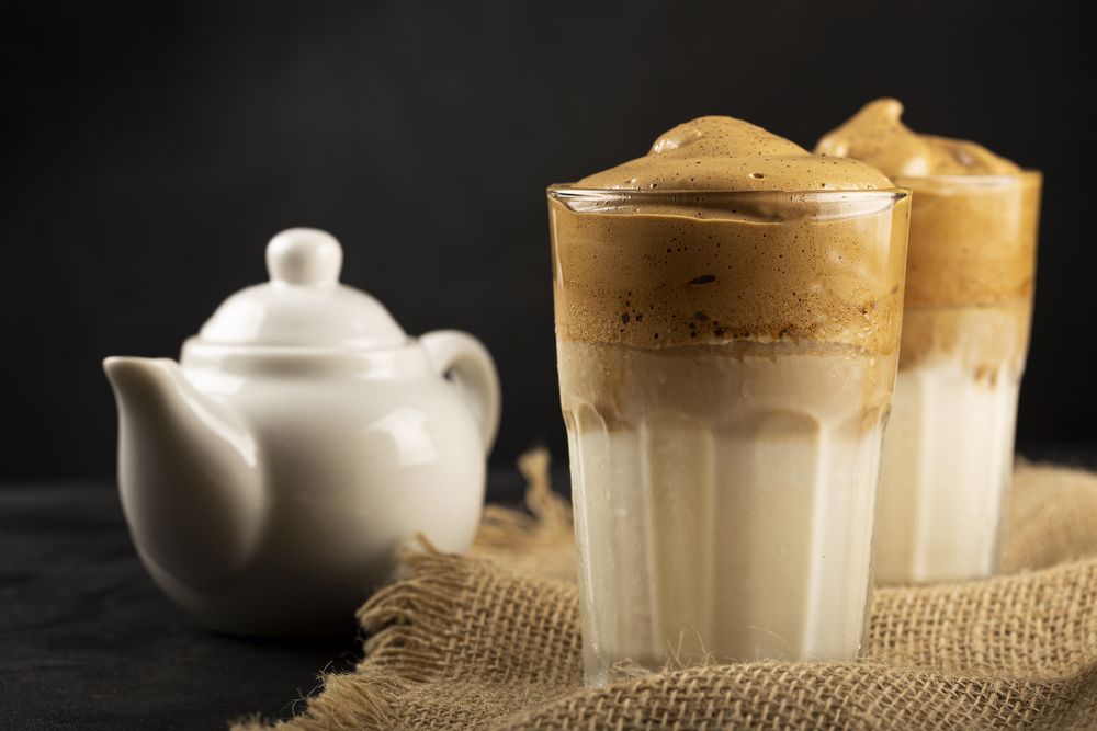 Iced Dalgona Coffee, glass with milk and coffee cream.