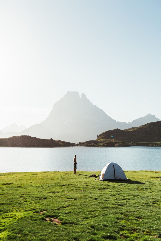 Man near the tent in the mountain