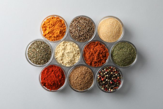 Top view of bowls of spice in neat rows