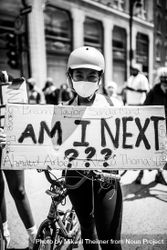 MONTREAL, QUEBEC, CANADA – June 7 2020- Woman with bike and helmet at protest 4BJrP4