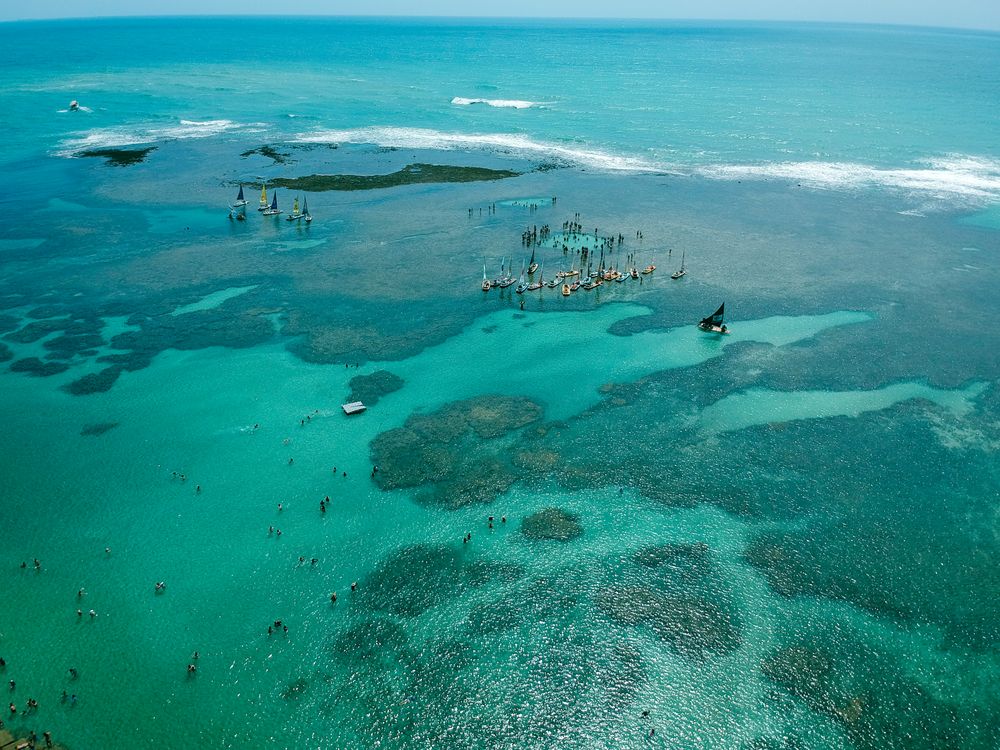 Sailboats in the clear waters of Porto de Galinhas Beach