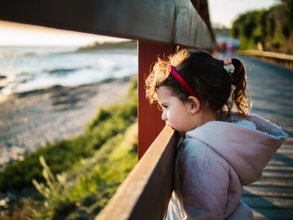 pensive girl at beach on winter