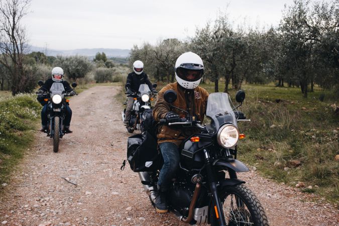 Group of people riding motorcycles off-road