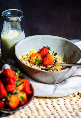 Healthy breakfast table with oatmeal and strawberry served with milk