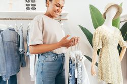 Woman working in a clothing shop