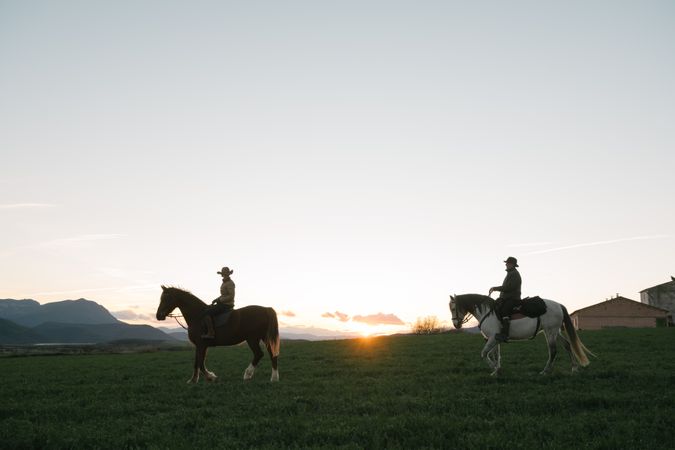 Man and woman riding horses