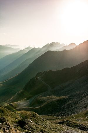 Mysterious mountain high in row in sunlight