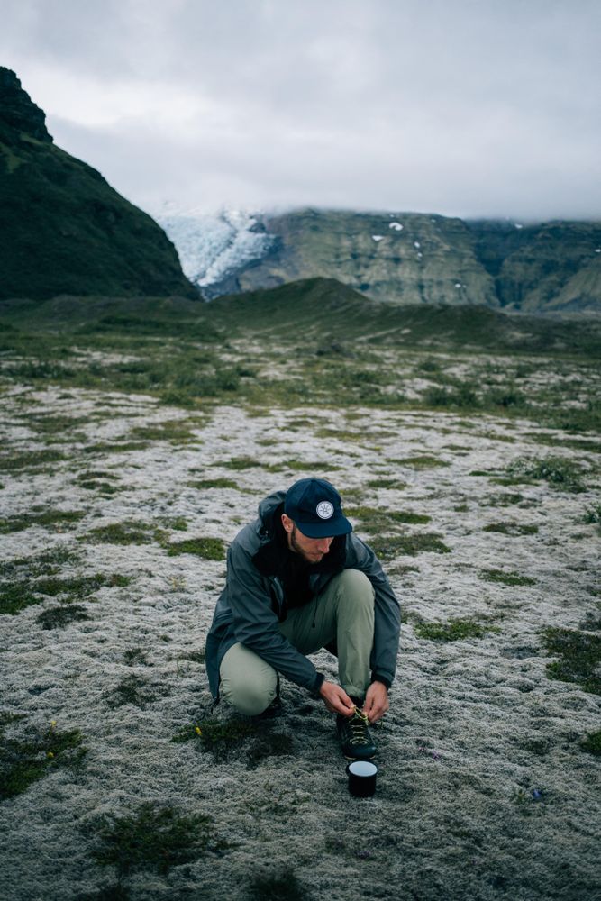 Man tying shoe on overcast day