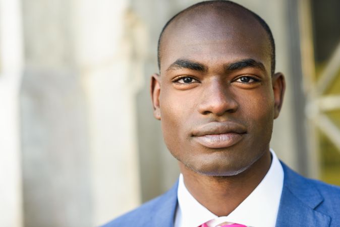 Close up of confident male in business attire with copy space