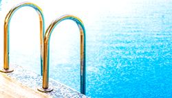 Golden pool railing in the sun