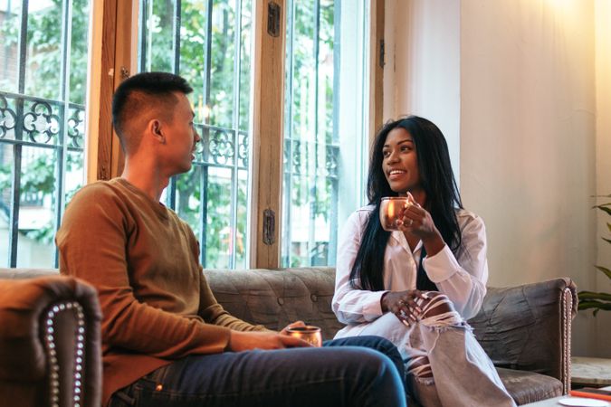 Asian man and a Black Latina woman on a date