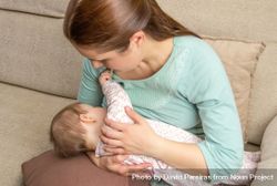 Baby breastfeeding with mother 42aZ15