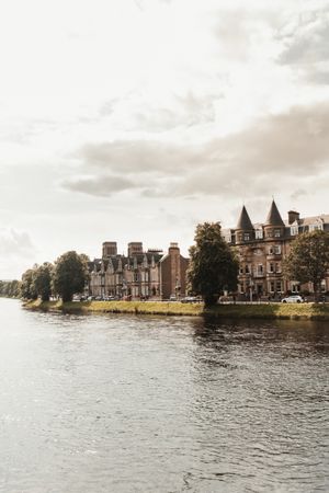 Medieval buildings next to small river in Scotland