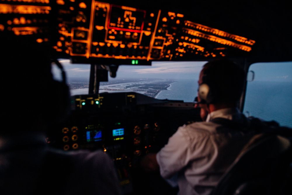 Back view of pilot in control room
