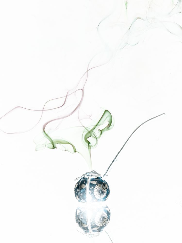 Jar with herbs emitting smoke
