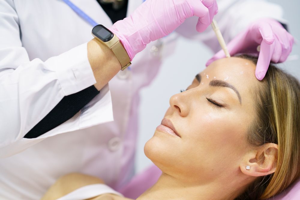 Woman having face prepared for beauty treatment