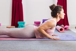 Young woman practicing yoga indoors