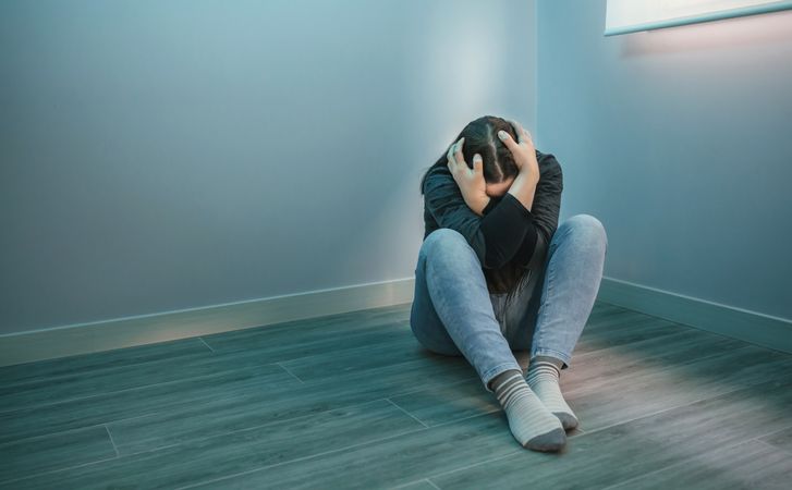 Unrecognizable woman experiencing great sadness