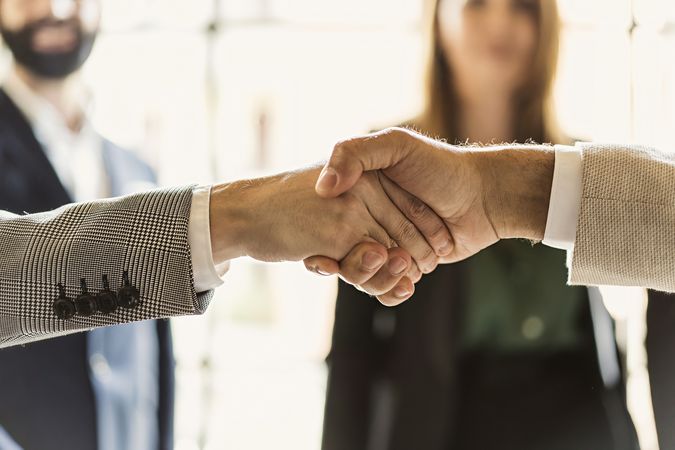 Businesspeople handshake in the office