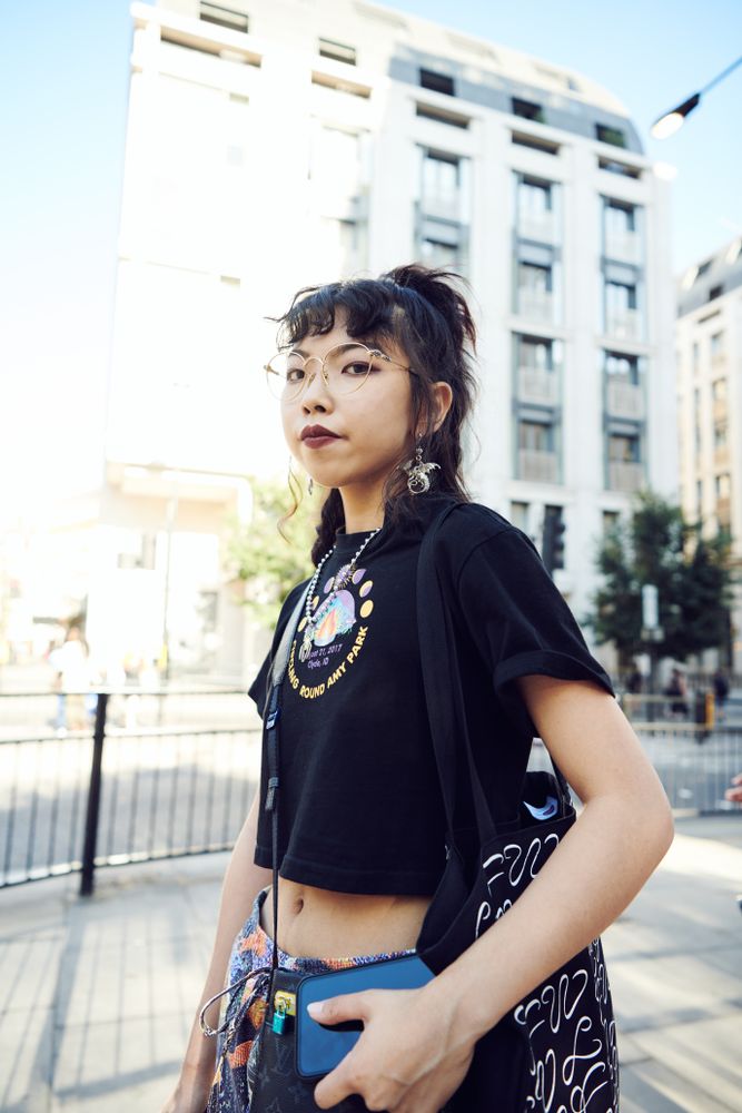 London, England, United Kingdom - September 15th, 2019: Young woman in streetwear pictured outside