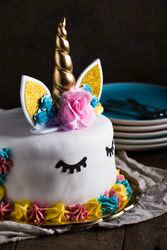 Cute unicorn cake with painted closed eyes