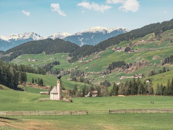 Small beautiful village between mountains with snow