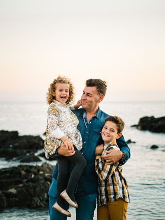 Father with her children at beach