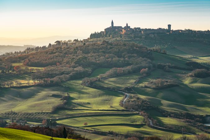 Majestic green valley with town on top