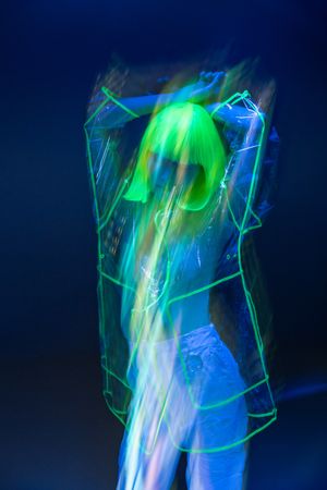 Asian woman posing in fluorescent light