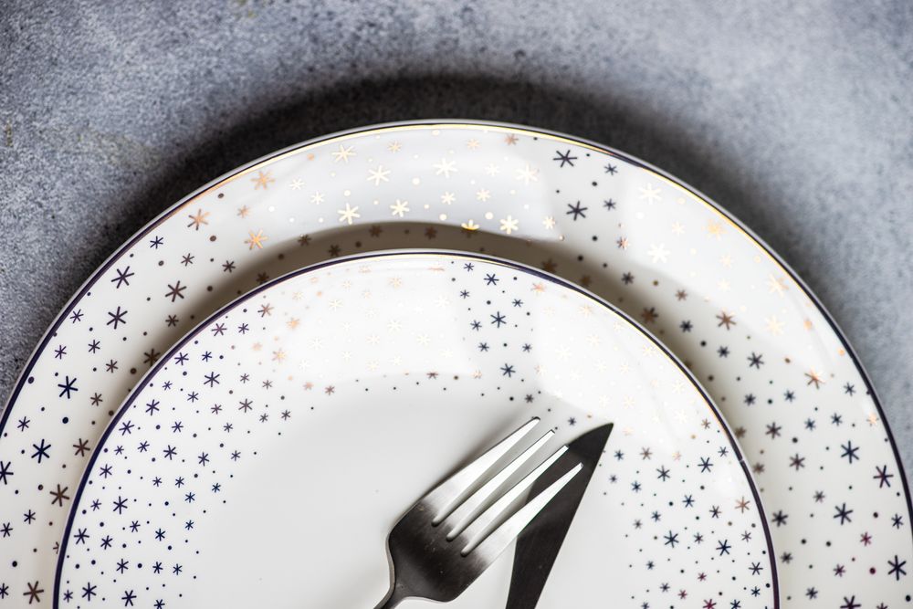 Close up of minimalistic snowflake table setting for Christmas