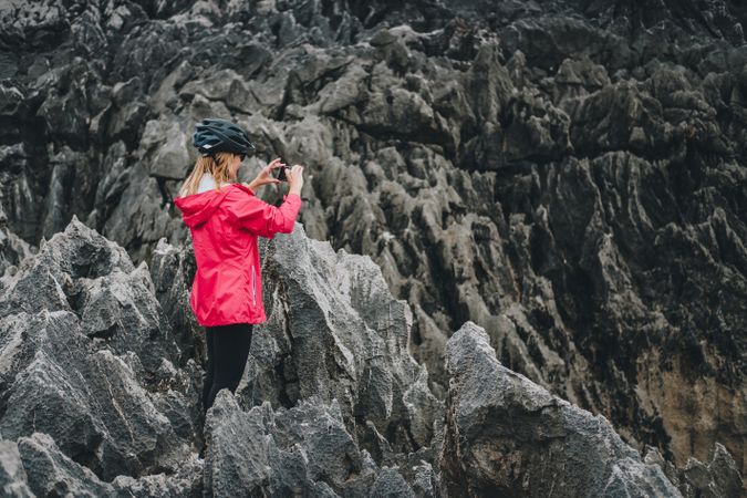 Female taking photos on cliffs
