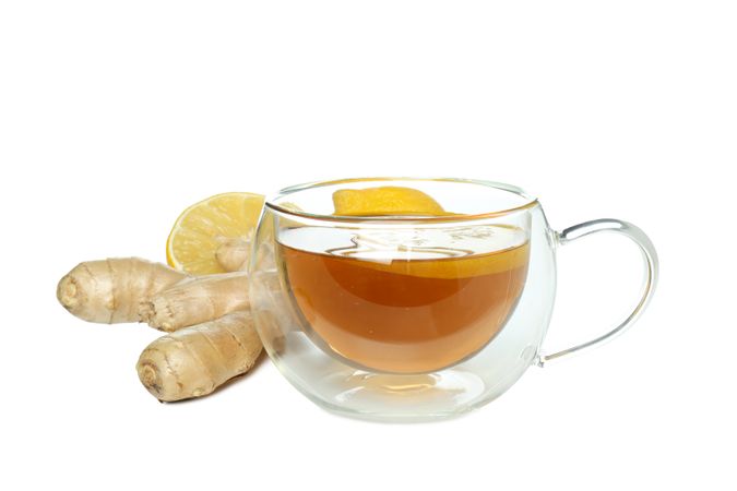 Cup of tea, ginger and lemon, isolated on plain background