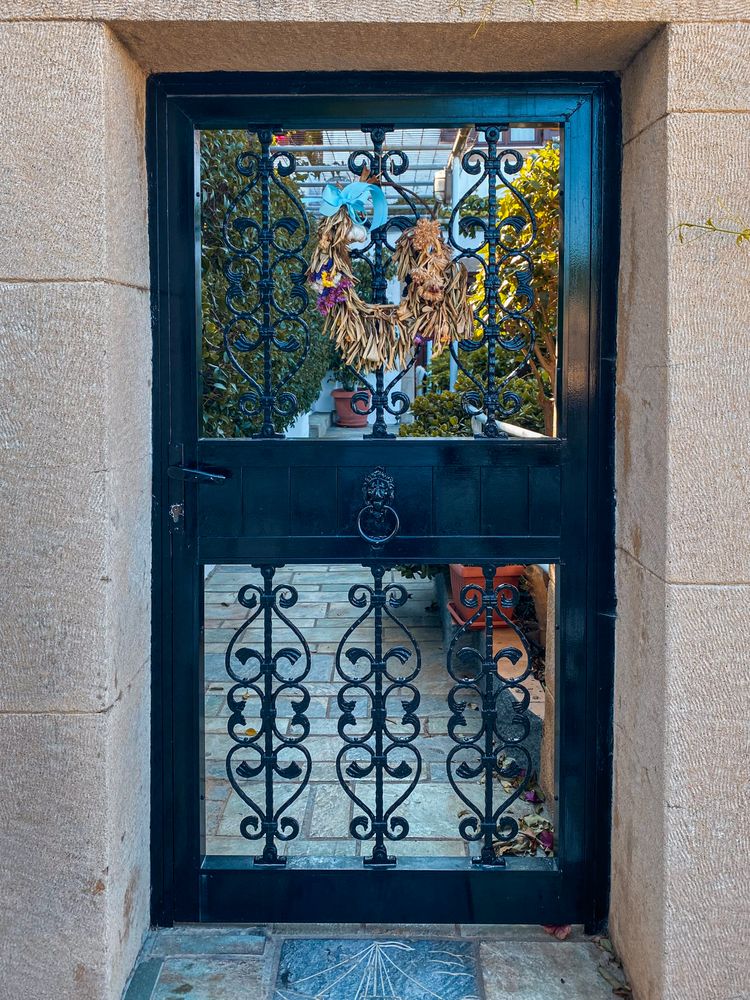 Patmian dark metal door