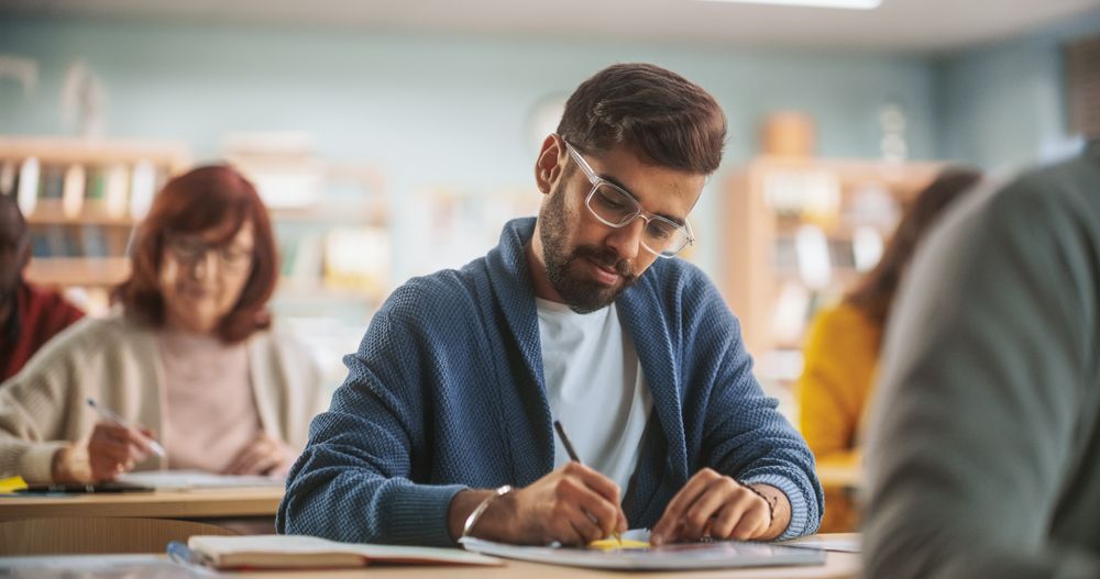 Portrait of an Indian Student Taking a Course in an International Adult Education Center.