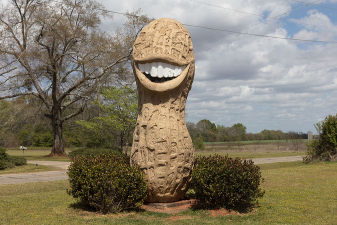 Smiling peanut statue in yard in Plains, Georgia