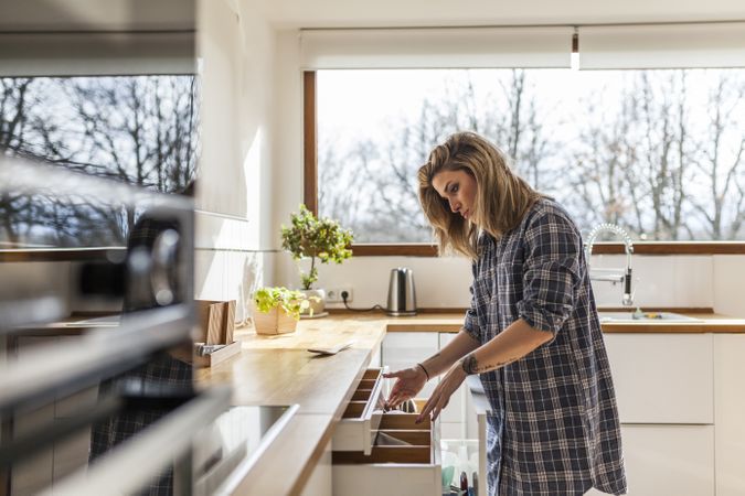 Woman at home in the kitchen
