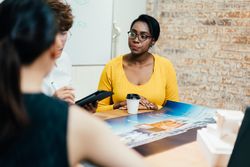 Multi-ethnic group of people at meeting in modern office