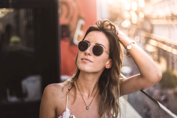 dreamy woman against sunny blurred background