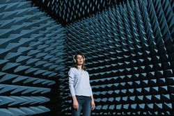 Woman in sound room listening to music