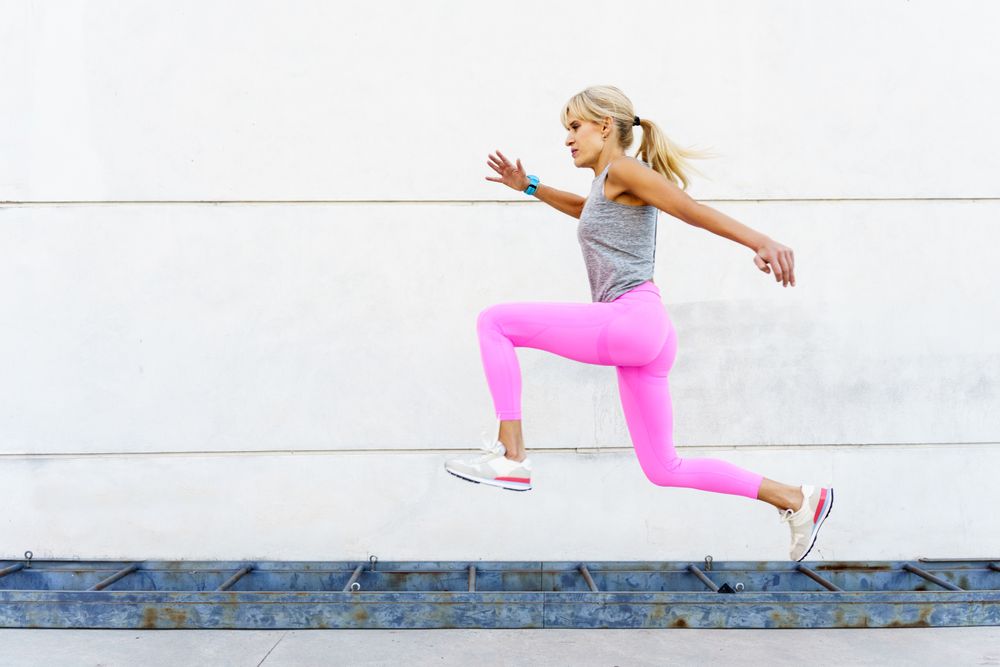 Fit woman doing jumping workouts