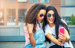 Happy women taking selfie outdoors