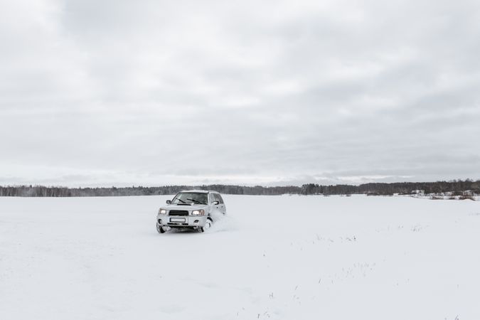 Car driving on snow field