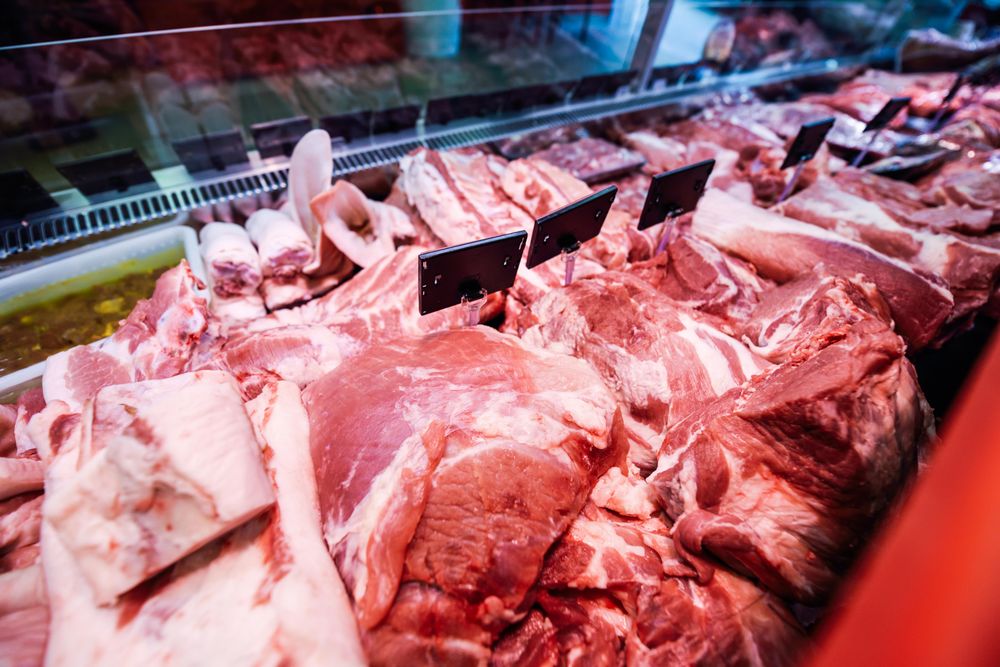 Meat behind glass in butcher shop