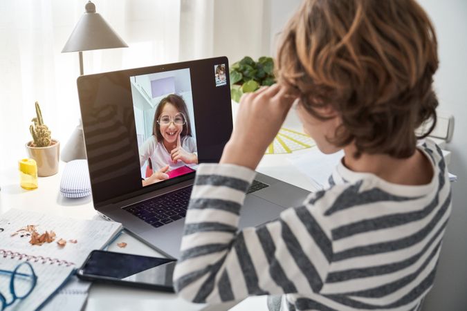 Boy having video call with friend