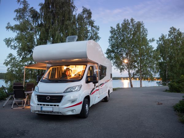Camper car parking for picnic near lake